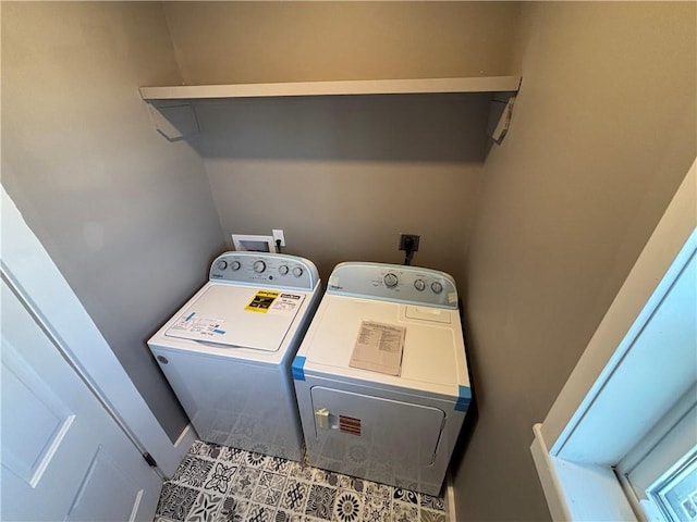 clothes washing area featuring washing machine and clothes dryer