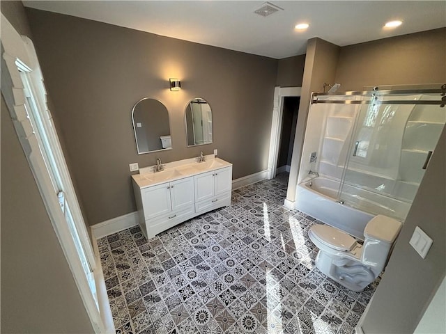 full bathroom with vanity, shower / bath combination with glass door, and toilet