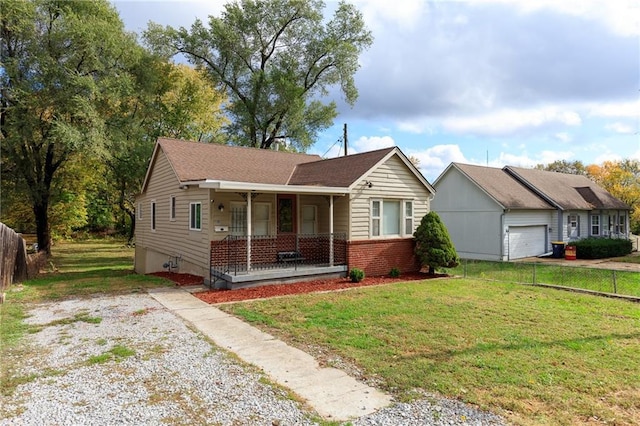 view of front of property featuring a front lawn and a porch