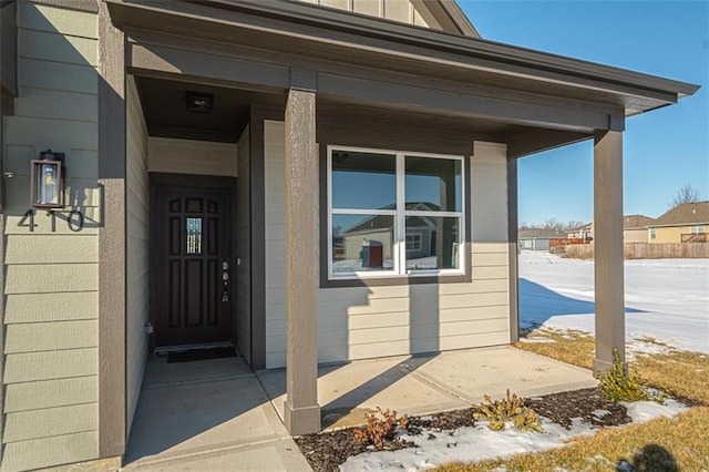 property entrance featuring a porch