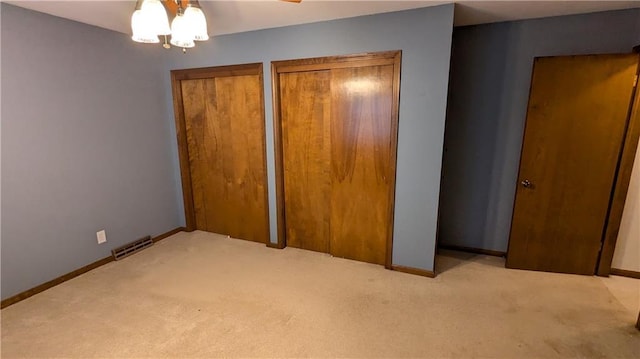 unfurnished bedroom with light carpet