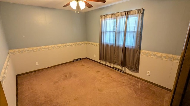 carpeted empty room with ceiling fan