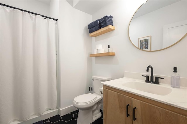 full bath featuring a shower with curtain, vanity, toilet, and tile patterned floors