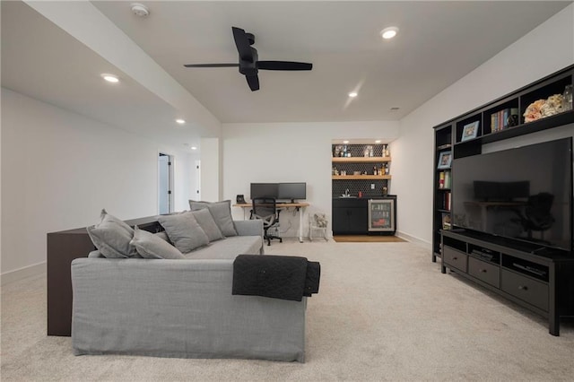 living area with built in features, baseboards, ceiling fan, carpet flooring, and recessed lighting