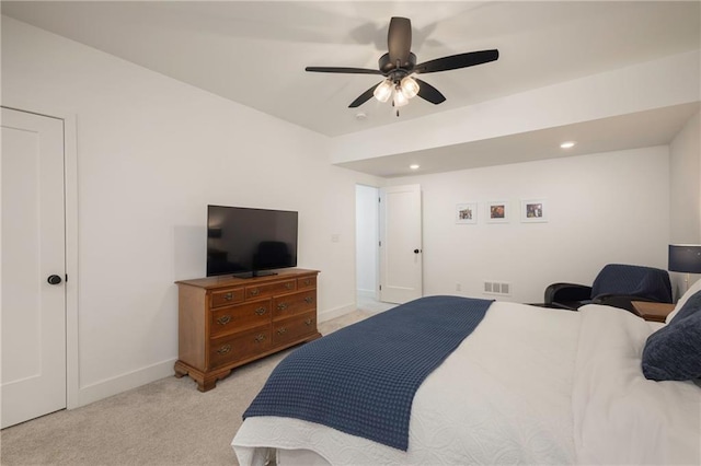 bedroom with light carpet and ceiling fan