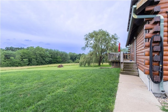 view of yard featuring a wooden deck