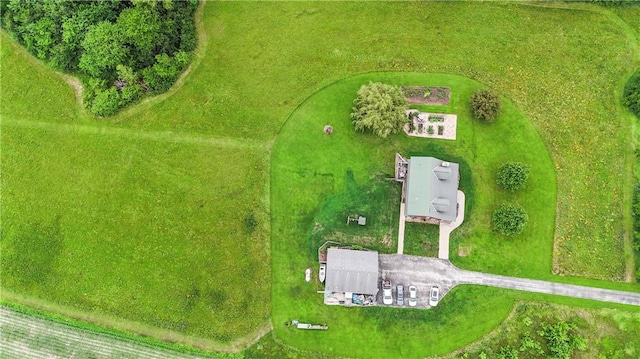 birds eye view of property with a rural view