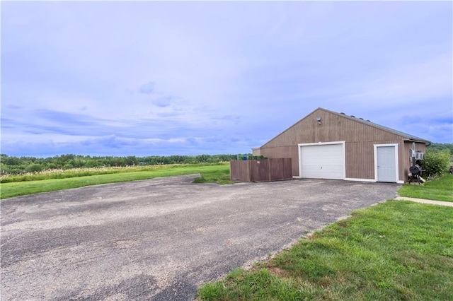 garage featuring a yard