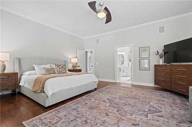 bedroom featuring crown molding, wood finished floors, visible vents, and baseboards