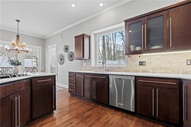 kitchen featuring a sink, white gas stovetop, light countertops, and stainless steel dishwasher