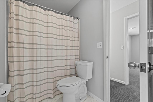 full bathroom with toilet, tile patterned flooring, baseboards, and a shower with shower curtain