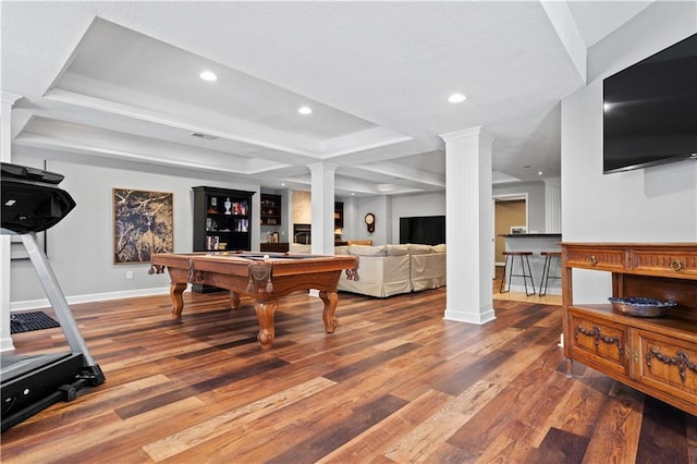 game room with recessed lighting, pool table, wood finished floors, a tray ceiling, and decorative columns