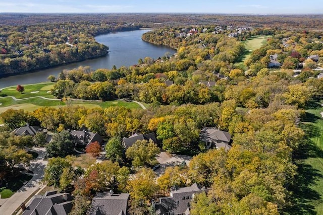 bird's eye view featuring a forest view and a water view