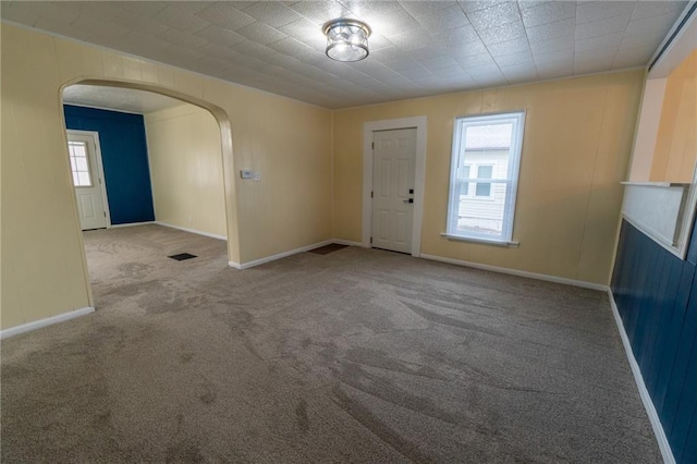 interior space featuring a wealth of natural light and light colored carpet