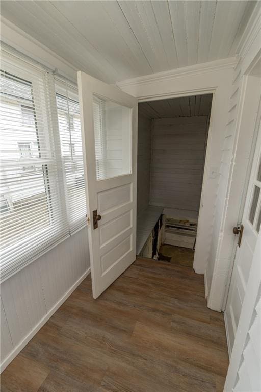 hallway with hardwood / wood-style flooring and wood ceiling