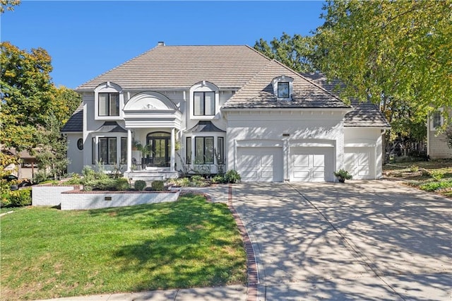 view of front facade with a garage and a front yard