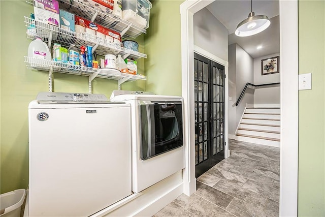 washroom with independent washer and dryer