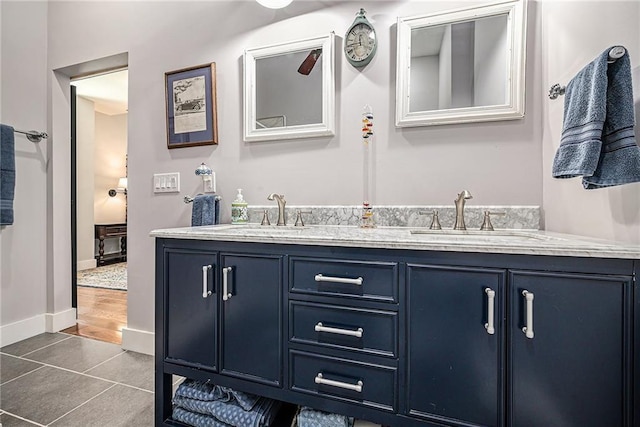 bathroom featuring tile patterned flooring and vanity