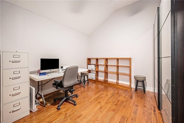 office area with lofted ceiling and light wood-type flooring