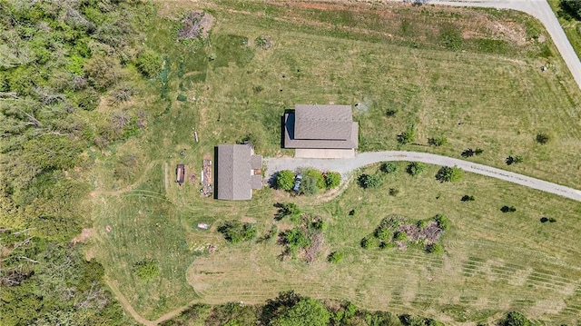 birds eye view of property with a rural view