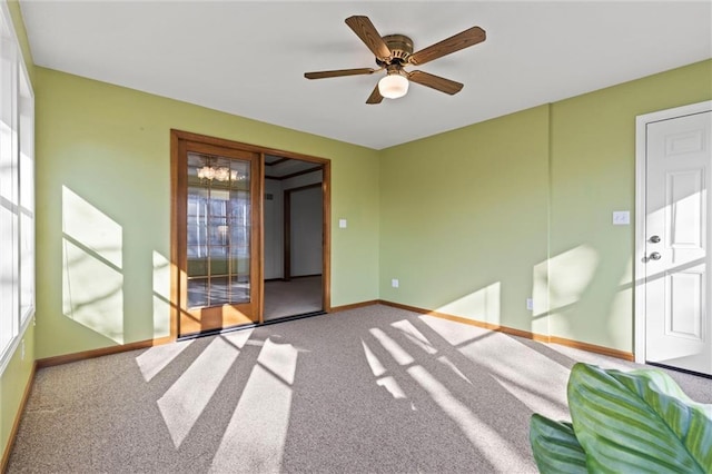 interior space with ceiling fan