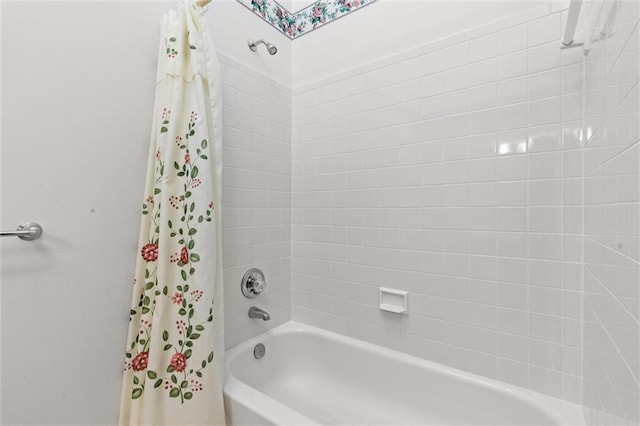 bathroom featuring shower / tub combo with curtain