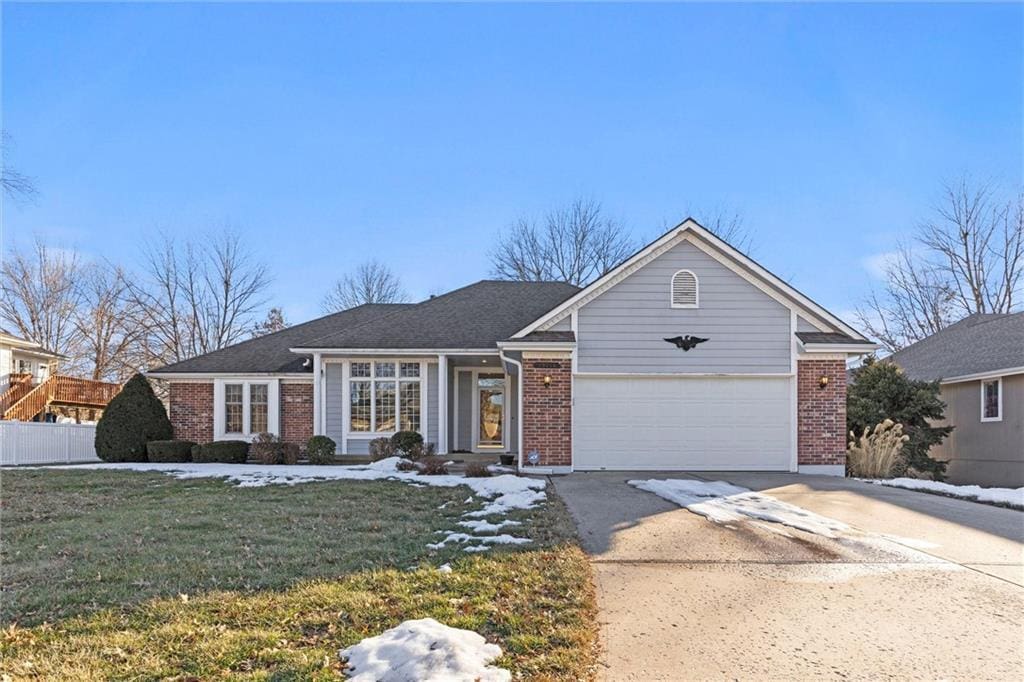 view of front of house with a garage and a front yard