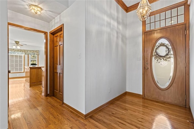 foyer with a chandelier and light hardwood / wood-style floors