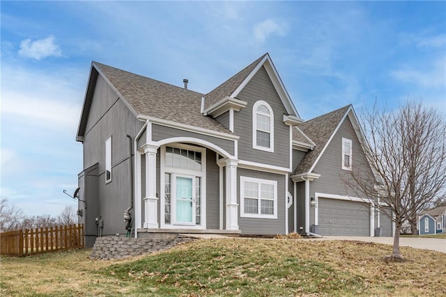 front of property featuring a garage and a front lawn