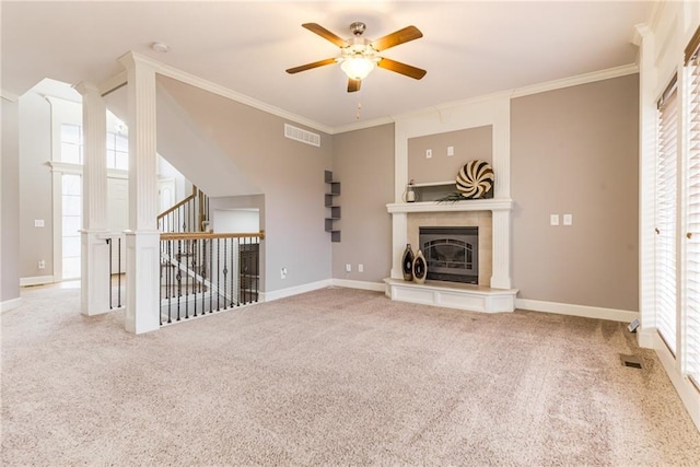 unfurnished living room with crown molding, ceiling fan, and carpet