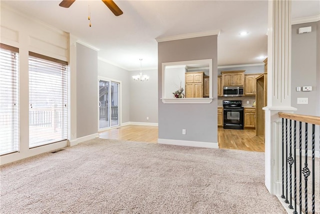 carpeted living room with ornamental molding and ceiling fan with notable chandelier