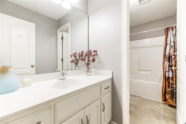 bathroom featuring vanity and shower / bath combo