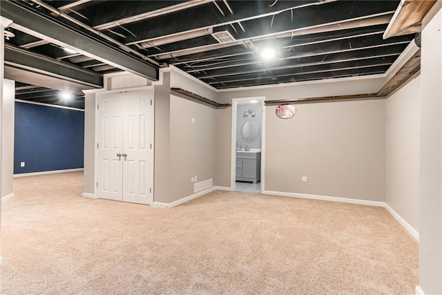 basement with light colored carpet