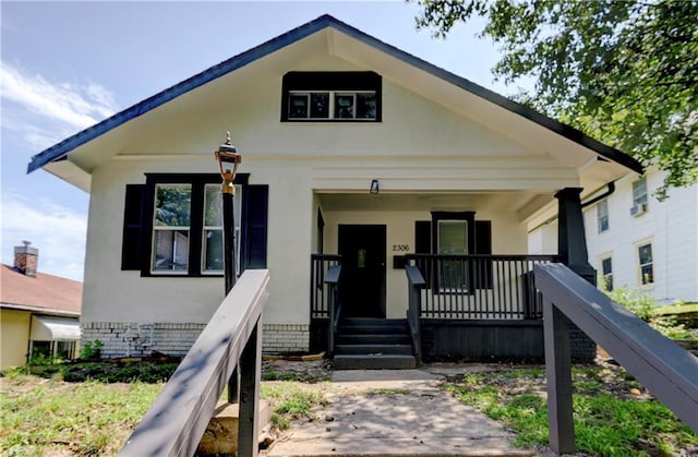 bungalow-style home featuring a porch