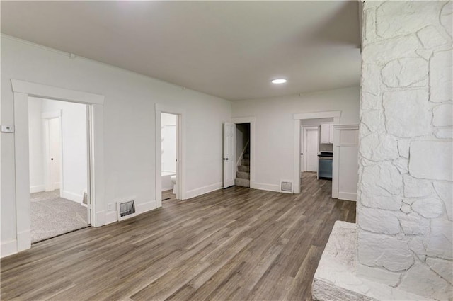 unfurnished living room featuring hardwood / wood-style floors