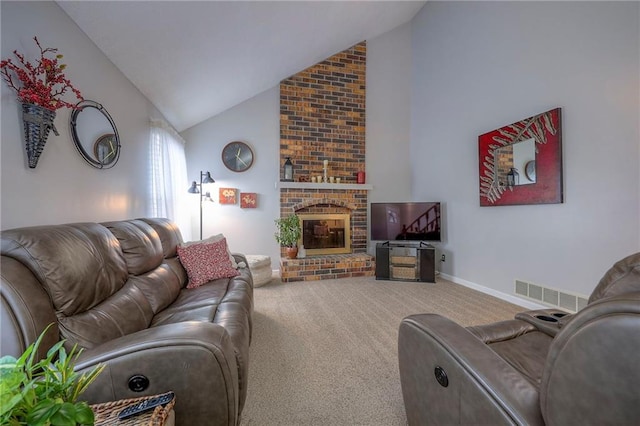 carpeted living room featuring a fireplace and high vaulted ceiling