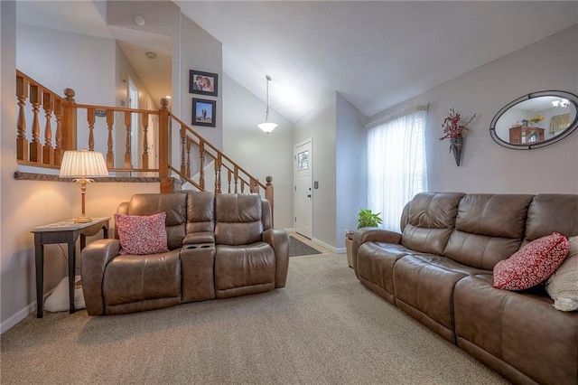 living room featuring high vaulted ceiling and carpet