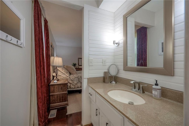 bathroom featuring vanity and wood-type flooring