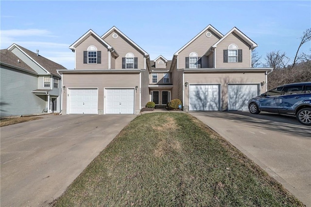 traditional-style house with concrete driveway and an attached garage