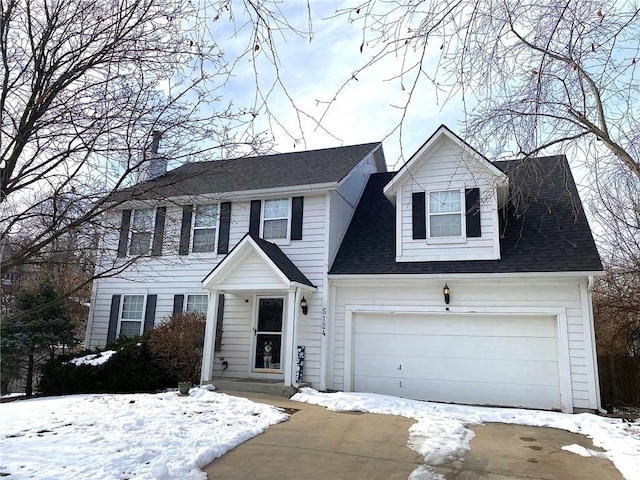 colonial-style house featuring a garage