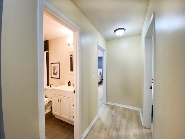 corridor featuring light wood-type flooring