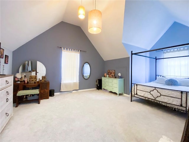 carpeted bedroom with lofted ceiling