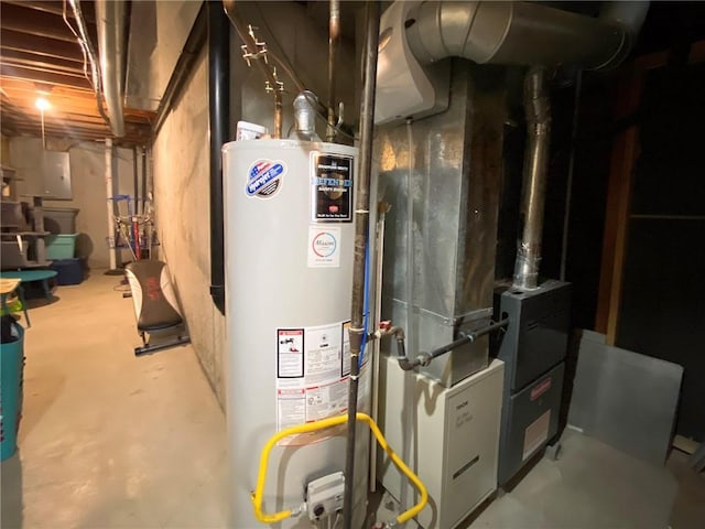 utility room featuring water heater