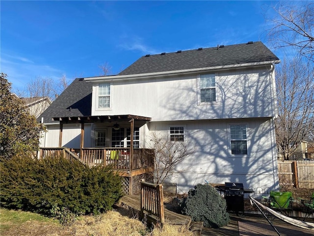 back of property featuring a wooden deck