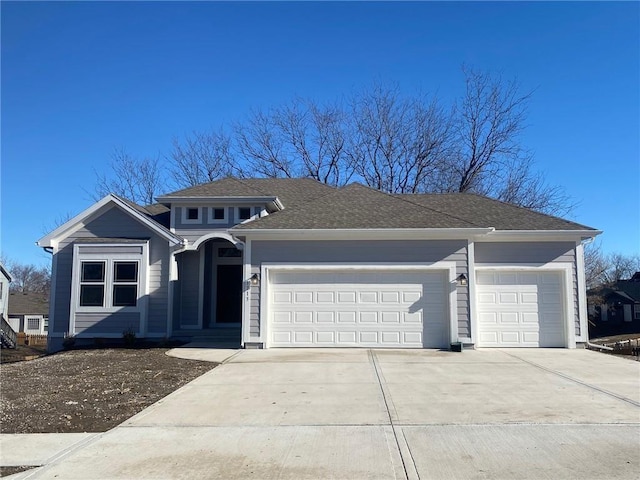 view of front of property featuring a garage and concrete driveway