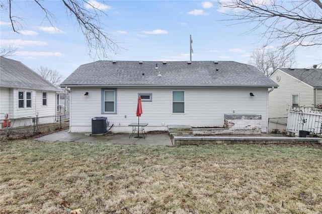 back of house featuring a yard, a patio area, and central air condition unit