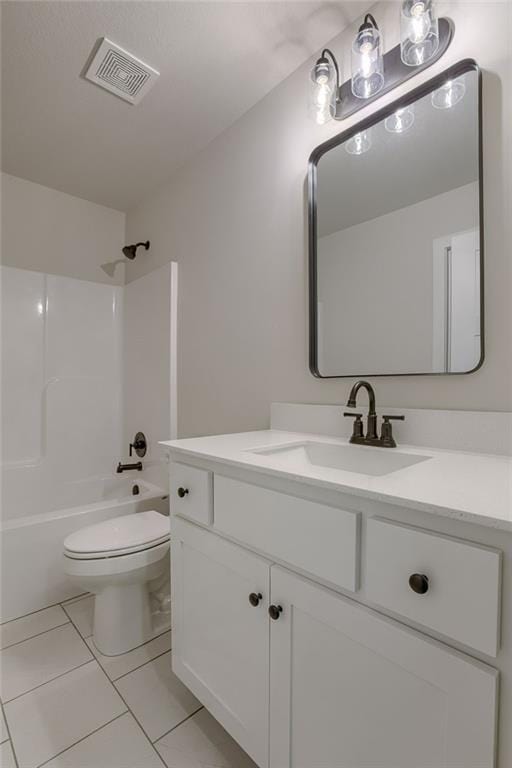 full bathroom featuring vanity, bathing tub / shower combination, tile patterned floors, and toilet