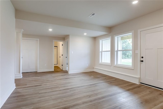 foyer entrance with light hardwood / wood-style floors