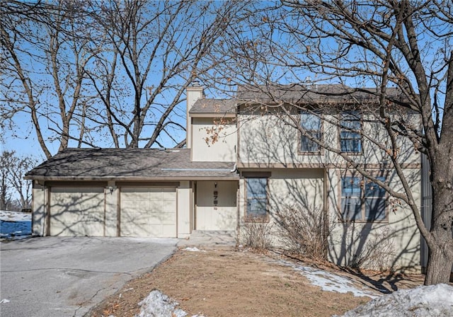 view of front of property with a garage