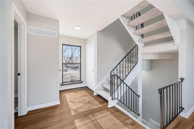 foyer with wood-type flooring